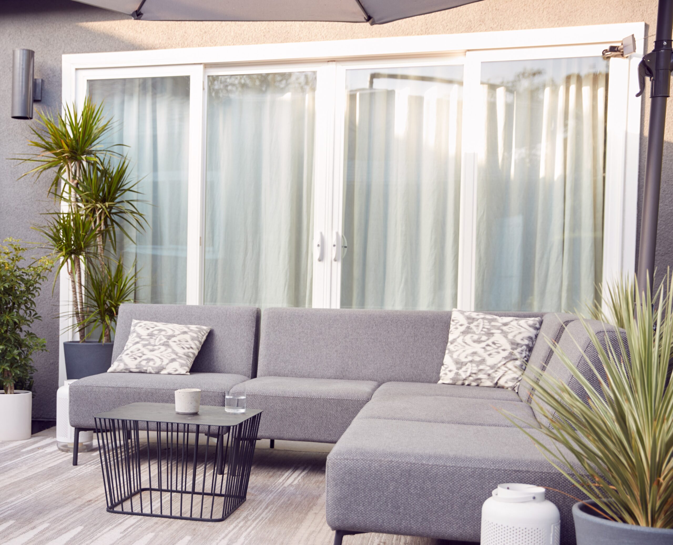 Outdoor Seating And Garden Furniture On Patio Of Contemporary Home